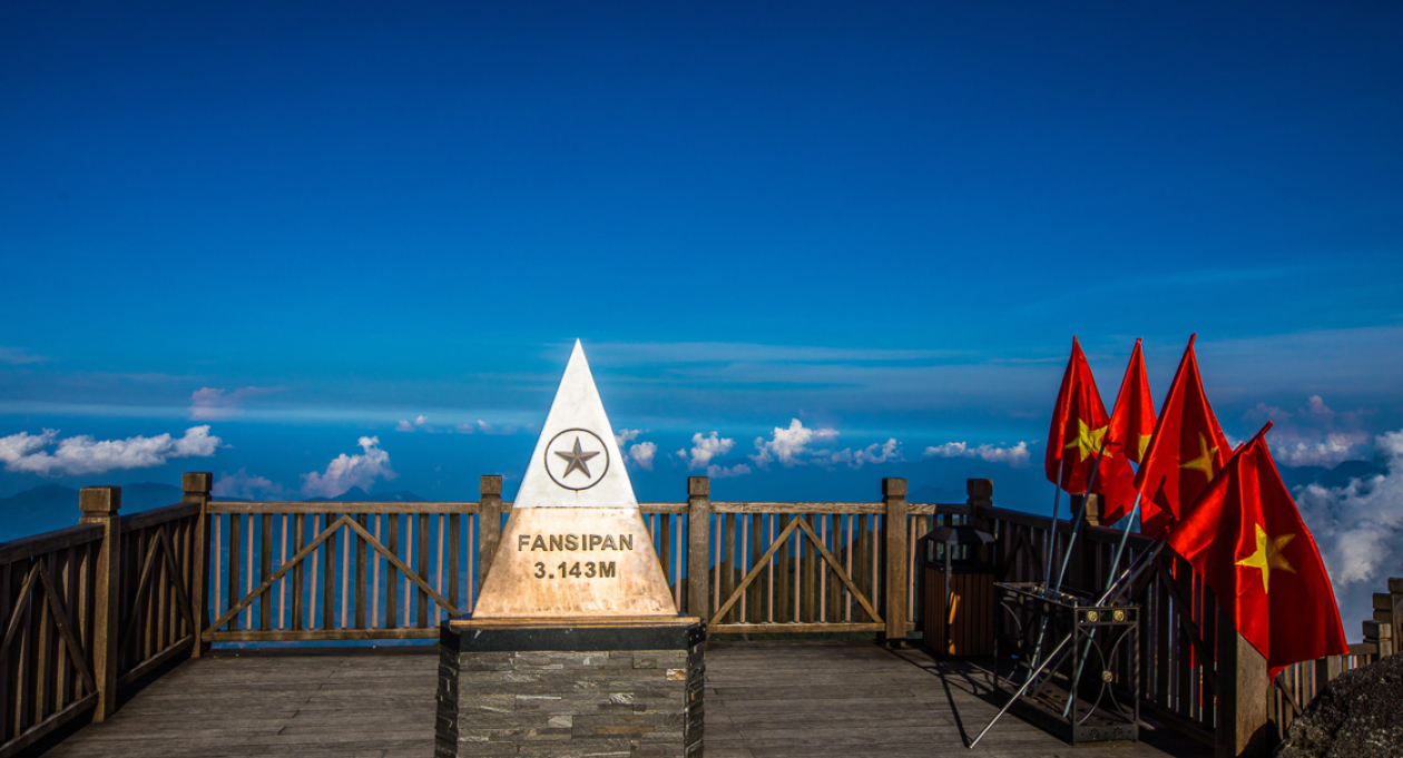View from Fansipan summit at 3,143m — the highest peak in Indochina, overlooking Sapa and the surrounding mountains