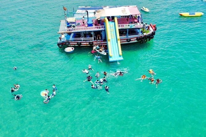 Floating bar party on Nha Trang Bay — guests enjoying cocktails and live music on the water